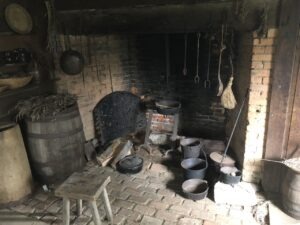 Large fireplace with pots and utensils