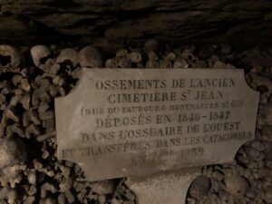 Inscribed tablet among wall of bones