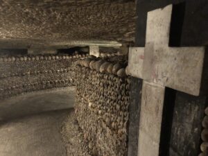 Painted cross in hallway of bones