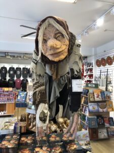 Large figure of Gryla with books and merchandise